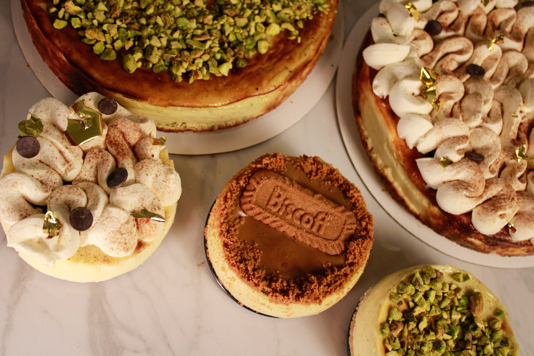 Whole basque cheesecake on dark wood